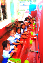 Children are happy at the hand washing station !
