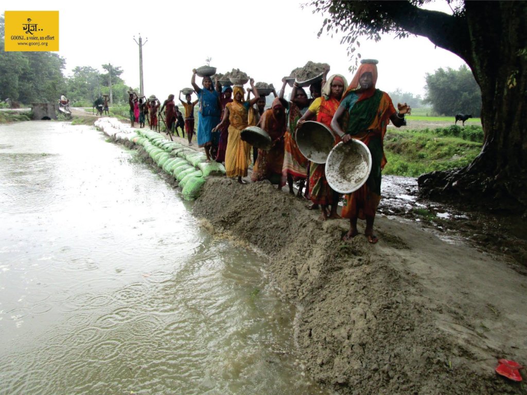 Community building a Check dam