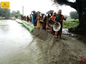 Community building a Check dam