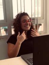 YES intern Anna giving online singing lesson