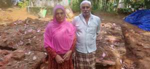 The couple at their collasped house site.....