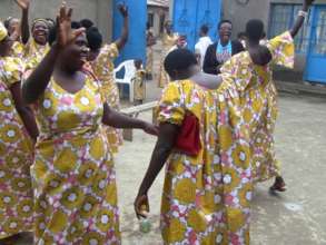Self help group dancing at annual meeting.