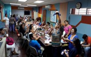 Petronila demonstrating the craft project