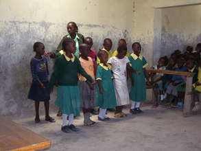Girls sing for visitors