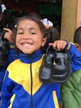 Happily showing her new school shoes!