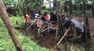 Sponsored Students Helping in the Garden