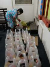 Sister Darn packaging food for distribution