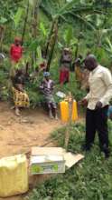 Justus installing the handwashing stations & soap