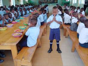 Saying Grace and praying for the meal sponsor