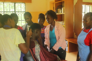 A young mother mastering barbering