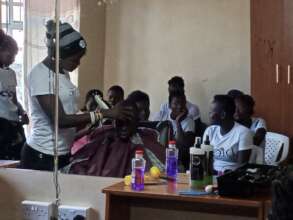 Apprenticeship girls during practicals on haircut