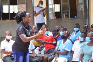 Social worker sensitizing students on SGBV and RH
