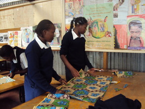 Teenage mums in class for tailoring