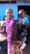 A teen mum graduate with her baby