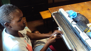 A Teenage mum in class with her 1 month  baby