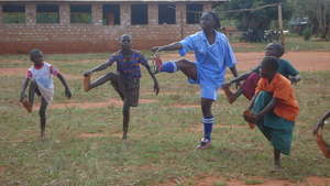 Coach, Janet Karembo, with young players