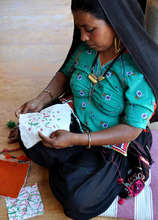 Jasiben contemplates design in embroidery