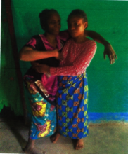 Blandine and her older sister in the village