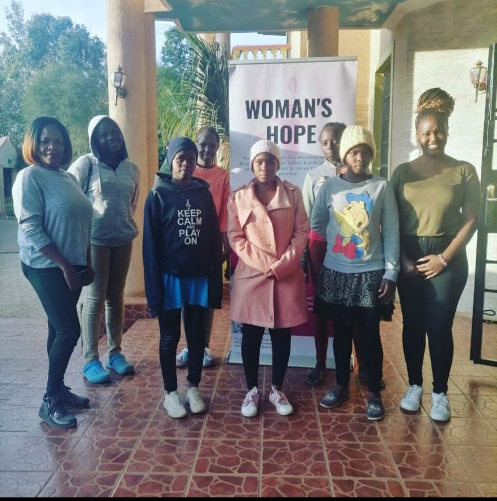 Some mentees pose with our director