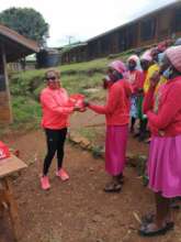The director gifting a dignity pack