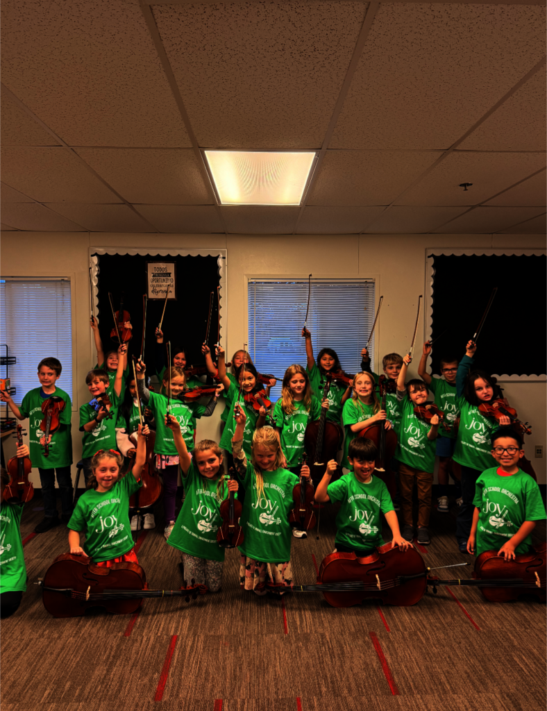 2nd Grade Joy ASO students show off new shirts