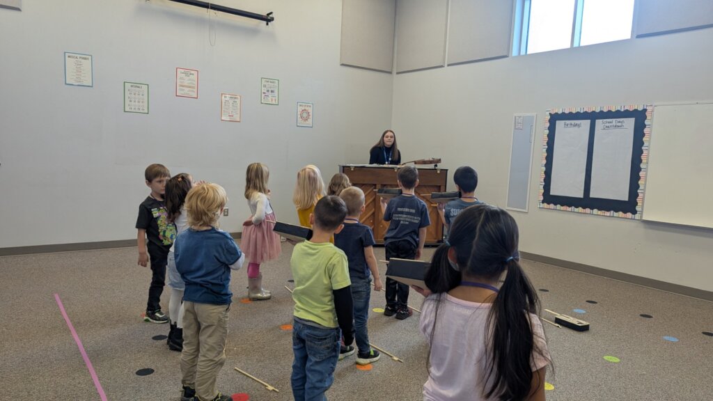 Kinder class works with box violins