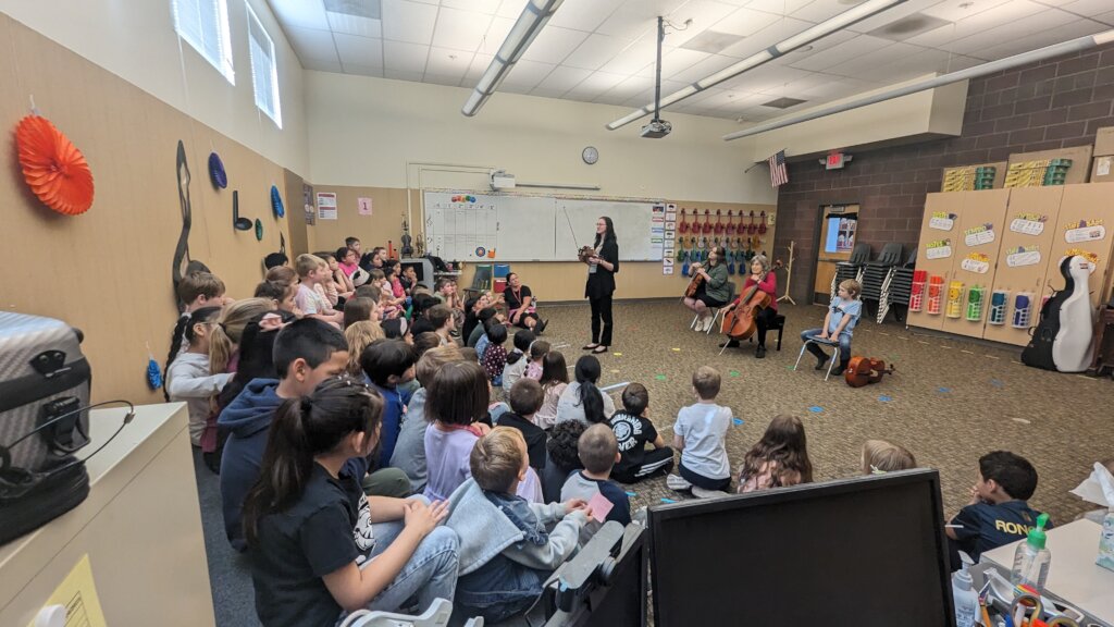 Newby 1st Graders hear the orchestra instruments