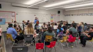 "Informance" where students taught family to play