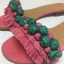 Fabric manipulation by artisans on strap sandal