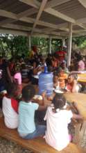 Families and friends enjoying a meal together