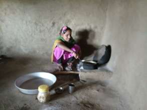Asha Taking Care of the Household Chores