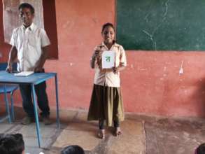 Asha Learning the Hindi Alphabet in Class