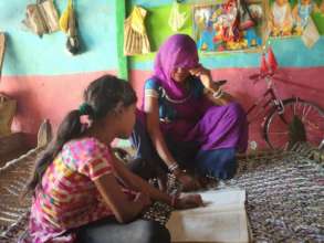 Lali telling her mother what she learnt in school