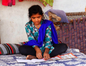 Pooja studies at home in her village in Barwani