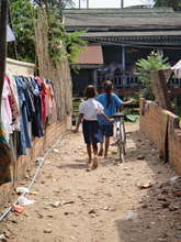Lotus Pedals recipients with bike
