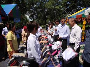 Girls receiving their new bikes