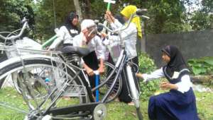 Girls pumping bikes