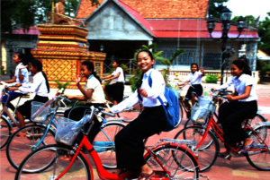 Bright and shining orphan girls on their bikes.