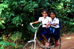 Children of poor families often share their bikes!