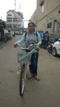 Meas receiving her bicycle.