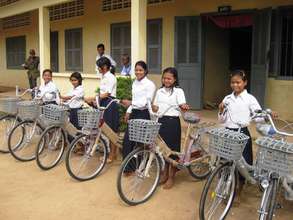 Girls in rural Mondulkiri receive their new bikes
