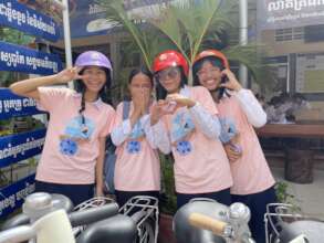 Sarorn (red helmet) with friends