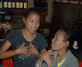 Thida chats with an NFE classmate at Goat Soup