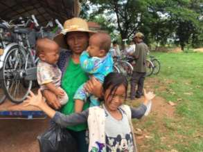 A Lotus Pedals beneficiary and her family