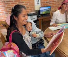 Joyful mother resuming her education in our center