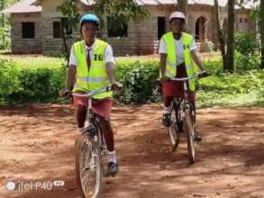 Bicycles help Juliette and Mercy stay in school.