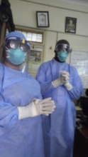 Our team demonstrating how to use PPE