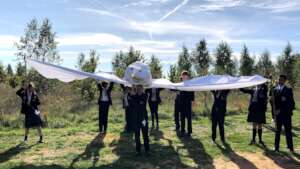 Harrow Way students carry the giant Dove of Peace
