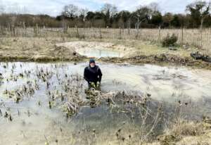 Brian tackles pond clearing despite the icy water