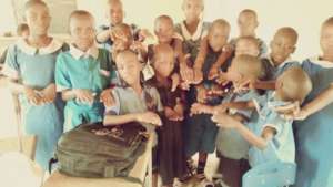 Kids displaying their neatly cut hair and nails